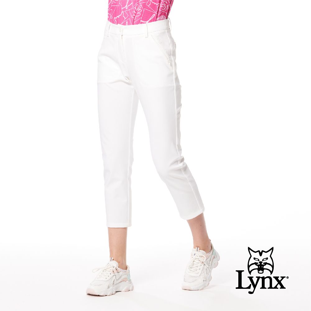 Lynx Golf 女款彈性舒適貼袋造型後腰LOGO針織帶剪接設計隱形拉鍊口袋窄管九分褲(二色)