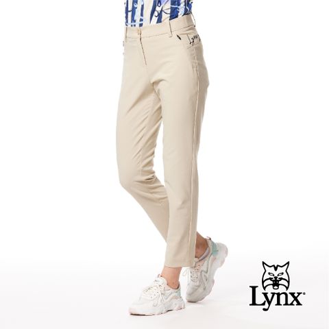 Lynx Golf 女款日本進口布料抗UV接觸冷感機能織帶剪接設計草寫繡花造型窄管九分褲-卡其色