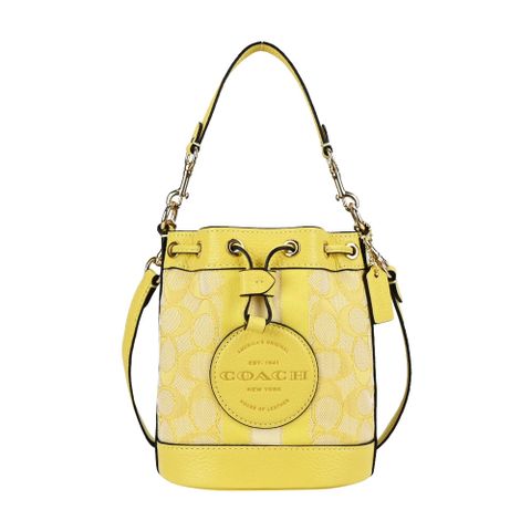 COACH DEMPSEY 圓標LOGO緹花C拼接皮革水桶包(迷你/復古黃)